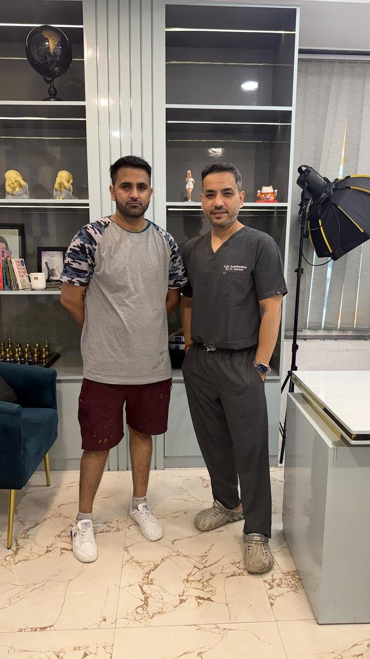 Dr Gaurav Solanki with patient after hair transplant consultation in Gurgaon