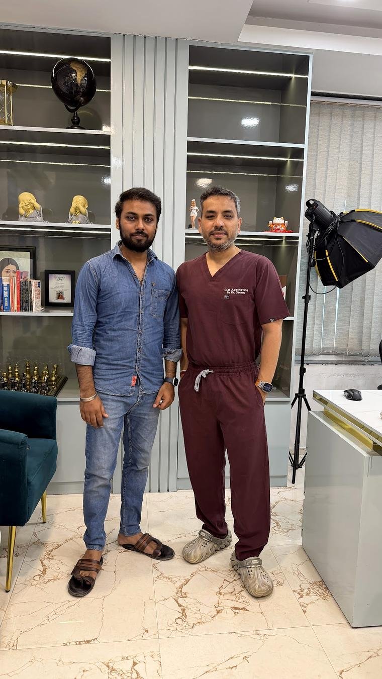 Dr Gaurav Solanki sharing results with a happy hair transplant patient