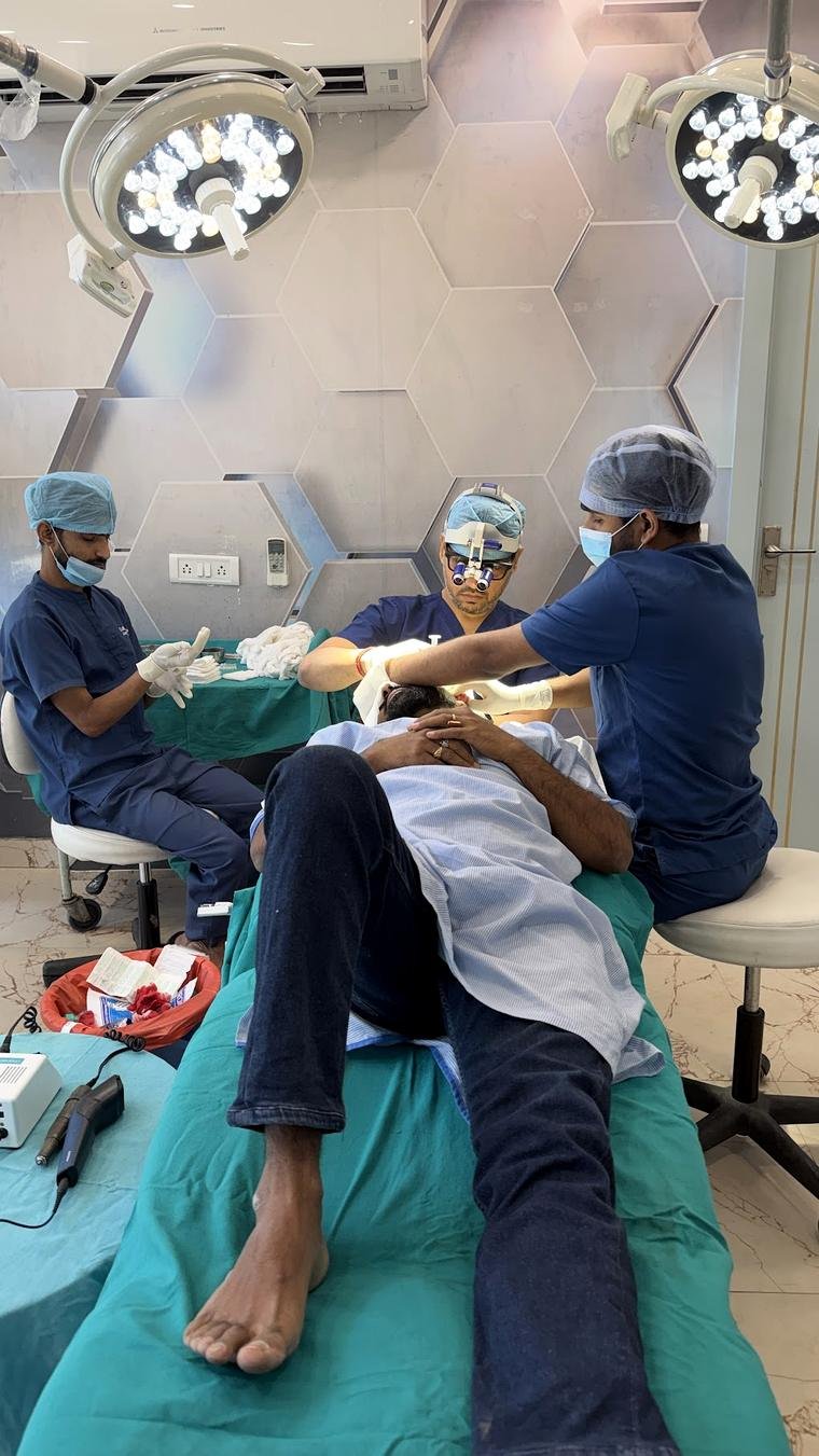 Dr Gaurav Solanki operating during a hair transplant procedure in Gurgaon